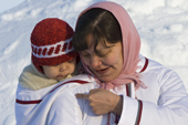Inuit mother Lisa Ann Irut and her baby. Hamlet Day. Igloolik. Nunavut, Canada. 2008
