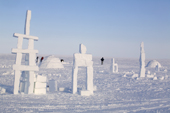 Igloos and Inukshuks built from snow as part of the celebrations for Hamlet Day in Igloolik. Nunavut, Canada. 2008