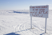 A sign by the frozen water reservoir near Igloolik. Nunavut, Canada. 2008