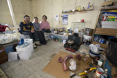 Jaipiti Palluq with his wife and son inside the hut at their outpost camp near Igloolik. Nunavut, Canada. 2008