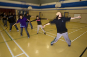 Marcel Dacosta giving a hip hop dance class to Inuit youngsters in the school gymnasium at Pangnirtung, Nunavut, Canada. 2008