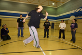 Marcel Dacosta demonstrates some moves during a hip hop dance class for Inuit youngsters in the school gymnasium at Pangnirtung, Nunavut, Canada. 2008