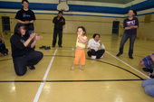 Inuit youngsters and a little girl enjoying a Hip hop dance class in the school gymnasium at Pangnirtung. Nunavut, Canada. 2008