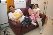 Noah Metuq and his wife Alukie relaxing with their neice at their home in the Inuit community of Pangnirtung. Nunavut, Canada. 2008