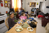The Metuq family at lunch time at their home in the Inuit community of Pangnirtung. Nunavut, Canada. 2008