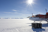 Antarctic Logistics & Expeditions' Twin Otter aircraft fuelling at cache beside ski-way at Thiel Mountains, Antarctica