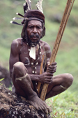 Yali Warrior in full paint & decorations holds poison arrows. Irian Jaya, Indonesia. 1990