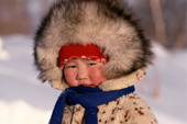 An Evenki girl warmly dressed against the cold. Evenkiya, Siberia, Russia. 1997