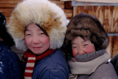 Evenki girls warmly wrapped up against the winter cold. Surinda, Evenkiya, Siberia, Russia. 1997