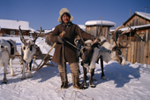 Andrei Konoriornok, an Evenki man, with his draft reindeer in the village of Surinda. Evenkiya, Central Siberia, Russia. 1997