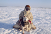 Olga Kirillova, a Sami woman from Lovozero, out on the tundra with her reindeer herding dog, Dik. Murmansk, NW Russia. 2005