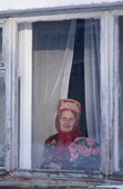 Maria Zakharova, an 82 year old Sami woman, at the window of her apartment in Lovozero. Murmansk, Kola Peninsula, NW Russia. 2005