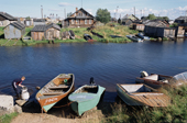 Boats on the river bank in the summer at Lovozero. Kola Peninsula, NW Russia. 2005