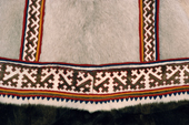Detail of the fine sewing of reindeer skin on the hem of a Nenets woman's Yagushka (coat). Yamal, Siberia, Russia