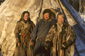 Tania Yaptik (left)together with her brother Otto and their elderly grandmother at their winter camp. Yamal, Western Siberia, Russia