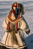 Albina Serotetto, a young Nenets girl in a Yagushka, a traditional winter coat made from reindeer skins. Yamal. Siberia. Russia.