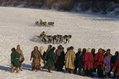 Nenets men watching reindeer racing at a local festival. Yamal. Siberia. Russia.