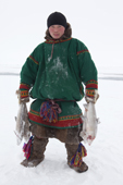 Pyotr Serotetto, a young Nenets men, carrying Muksun he has caught in a net set under the sea ice. Seyakha, Yamal Peninsula, Western Siberia
