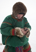 Edik Serotetto, a young Nenets man, sending a SMS message on his mobile phone. Seyakha, Yamal Peninsula, Western Siberia, Russia