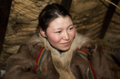 Puyni, a young Nenets woman, at a reindeer herder's camp near Tambey. Yamal Peninsula, Western Siberia, Russia