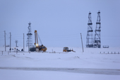 Gas drilling derricks & workers at Sabetta in the South Tambey gas field. Yamal Peninsula, Western Siberia, Russia