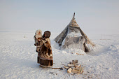 Emma Vanuito, a Nenets woman, with her daughter, Nenya at their winter camp near Tambey. Yamal Peninsula, Northwest Siberia, Russia.