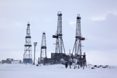 Drilling derricks near Sabetta in the South Tambey gas field. Yamal Peninsula, Western Siberia, Russia