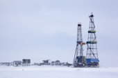 Drilling derricks near Sabetta in the South Tambey gas field. Yamal Peninsula, Western Siberia, Russia
