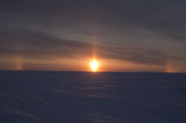 Sunset on the Tambey tundra showing a sun pillar and sun dogs (parhelia). Yamal Peninsula, Western Siberia, Russia