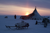 Sunset at a Nenets reindeer herder's winter camp on the tundra near Tambey. Yamal Peninsula, Western Siberia, Russia