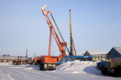 Trucks and heavy machinery in the gas workers' village of Sabetta near Tambey. Yamal Peninsula, Western Siberia, Russia