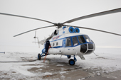 Re-fuelling a Yamal Airlines MI-8 helicopter in the north of the Yamal Peninsula. Western Siberia, Russia.