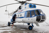 Re-fuelling a Yamal Airlines MI-8 helicopter in the north of the Yamal Peninsula. Western Siberia, Russia.