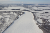 An aerial view of a frozen river & lakes in the south of the Yamal Peninsula. Western Siberia, Russia