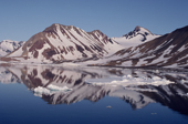 Mountains & glaciers in summer, reflected in southern Hornsund Fjord. Spitsbergen