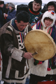A Chukchi man playing a shaman's drum. Northern Siberia, Russia.